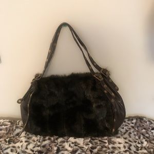 A stunning vegan purse, black faux fur satchel